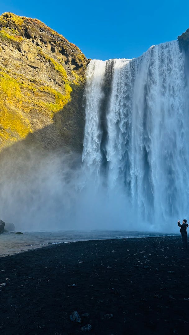 Iceland Adventure Tours: What to Expect When the Weather Doesn't Cooperate ToursZoom Skogafoss waterfall roaring through Iceland's south coast landscape