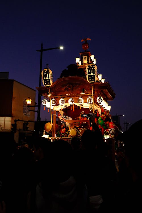 Japan's Best Festivals: A Traveler's Guide to When and Where to Go ToursZoom Japan festival float lit up at night during a traditional matsuri