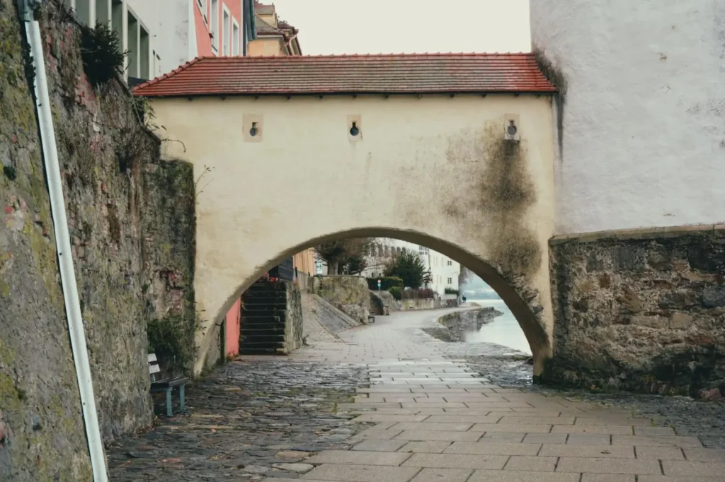 Sunlight illuminating the historic cobblestone streets of Passau, Germany
