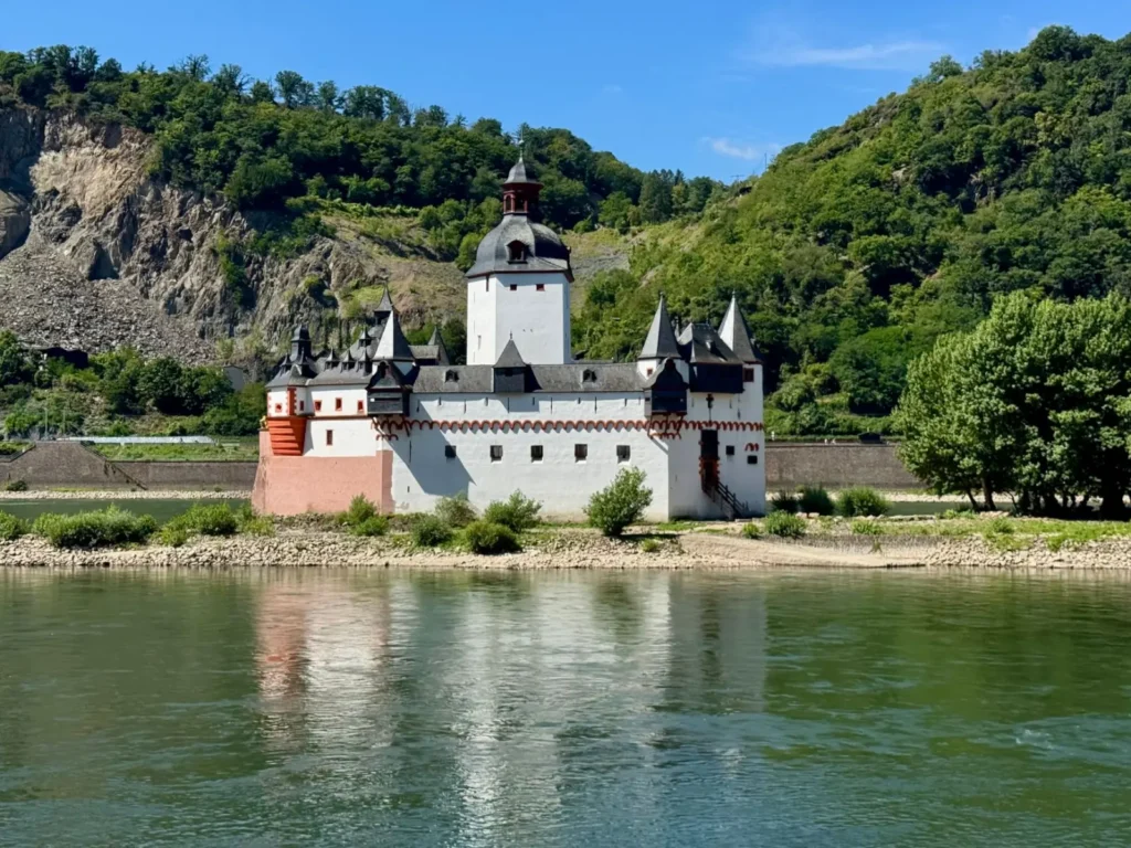 Rhine River Cruises Guide: Castles, Wine & Storybook Towns ToursZoom Lorelei Rock viewed from a boat on the Rhine River in Germany